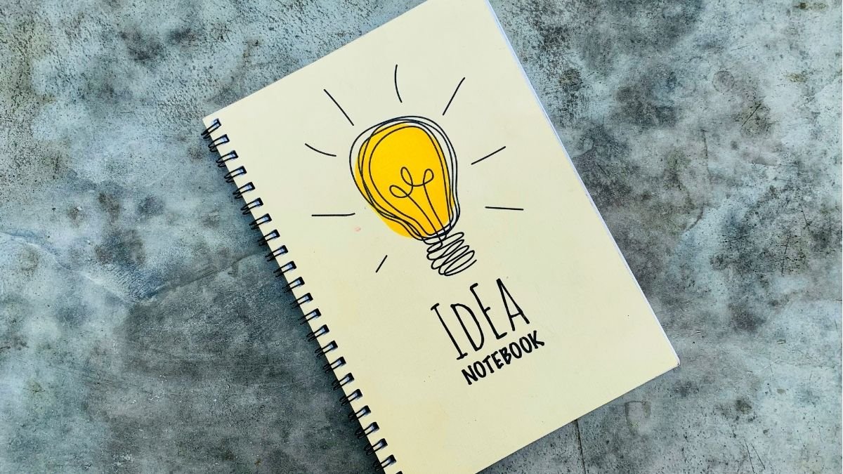 Notebook with a lightbulb on the cover as a method of capturing ideas