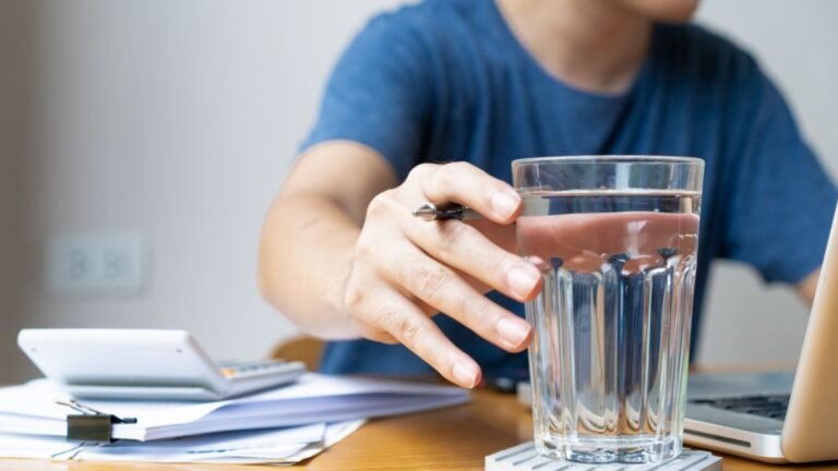 Person maintaining proper hydration for optimal brain function and cognitive performance